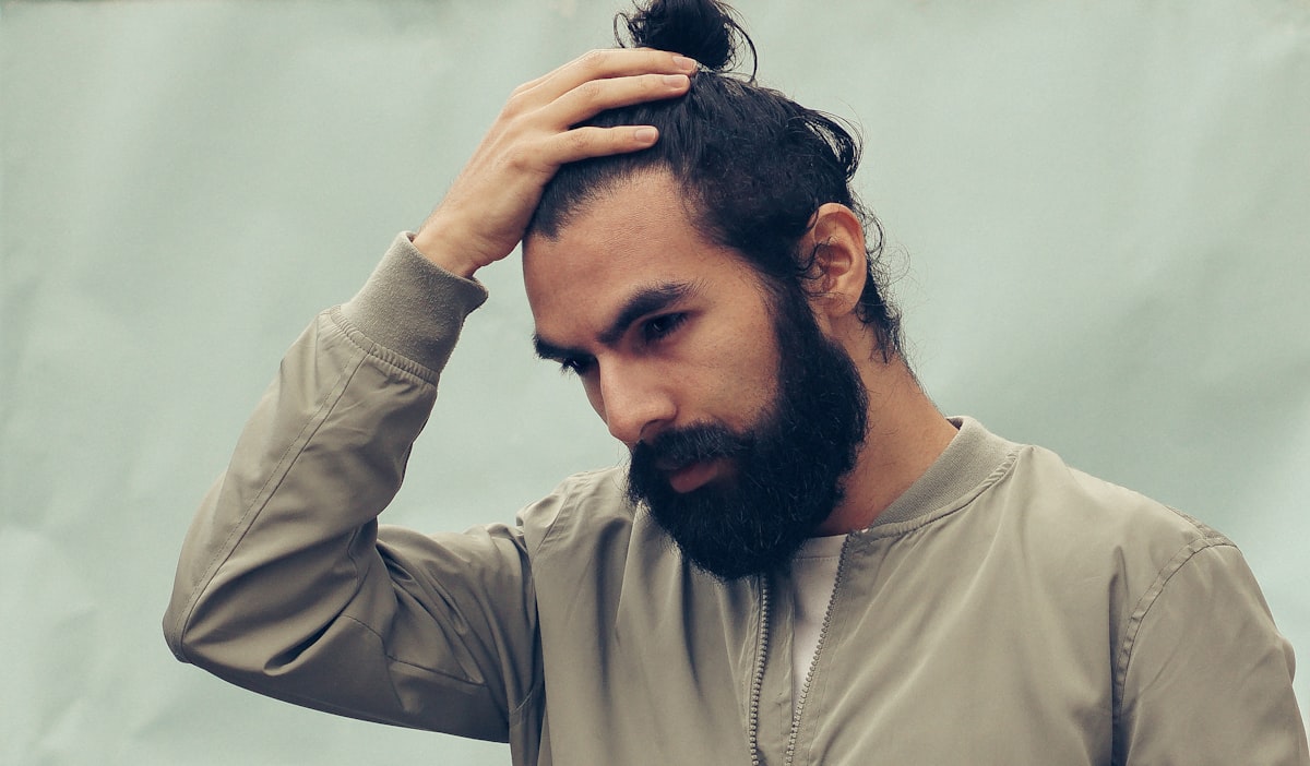 Man with healthy hair and skin showing nutrition impact